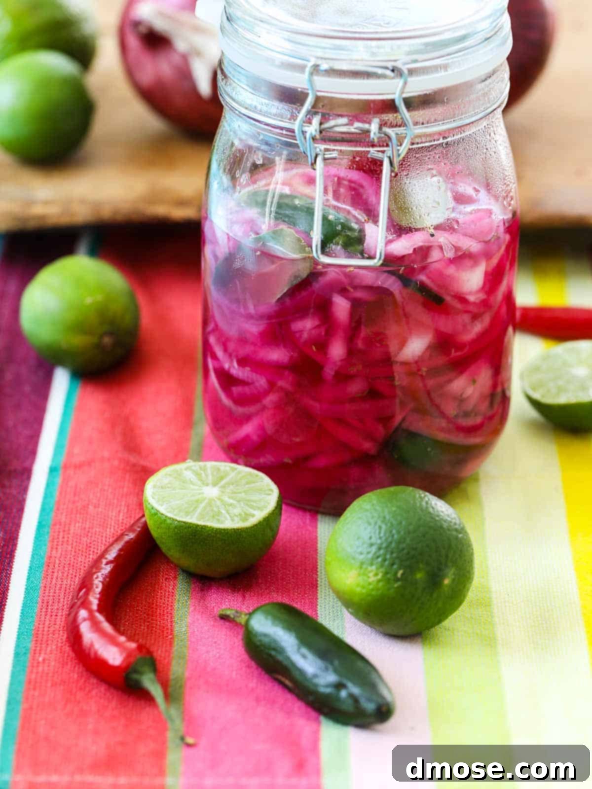 Mexican Pickled Red Onions in a clamp jar with chiles.