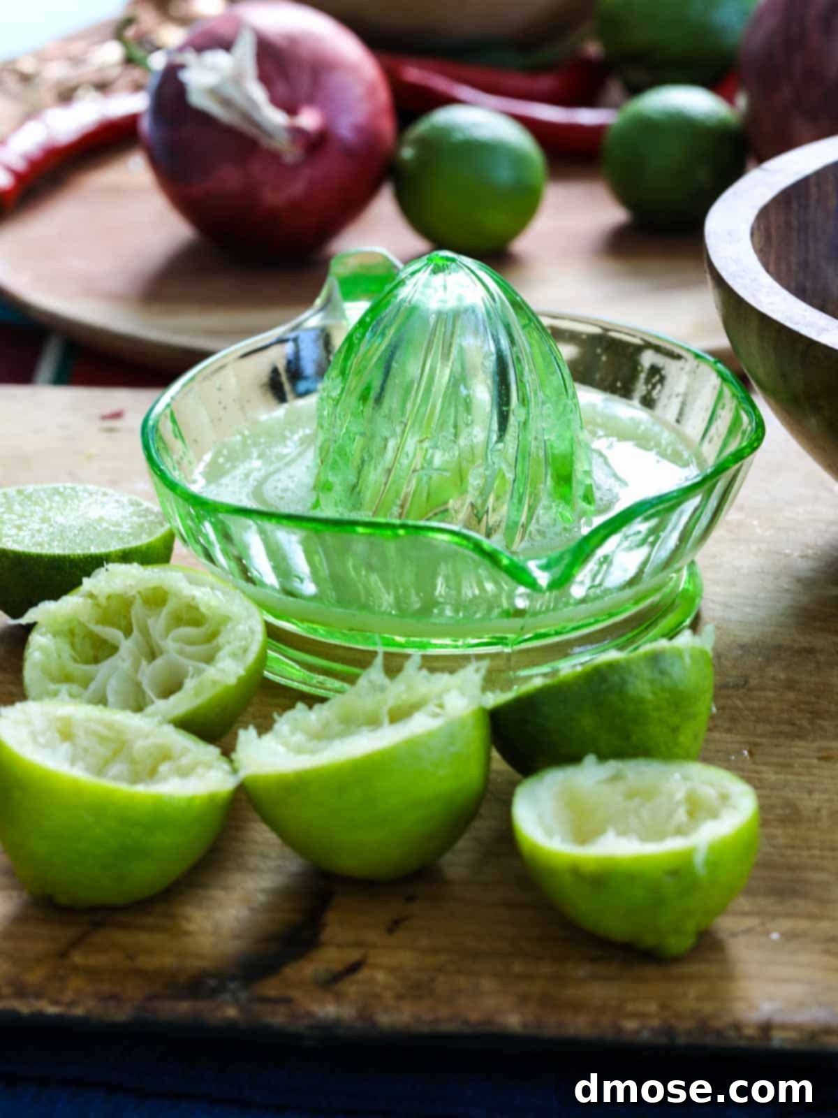 Squeezing limes to make Mexican Pickled red onions.