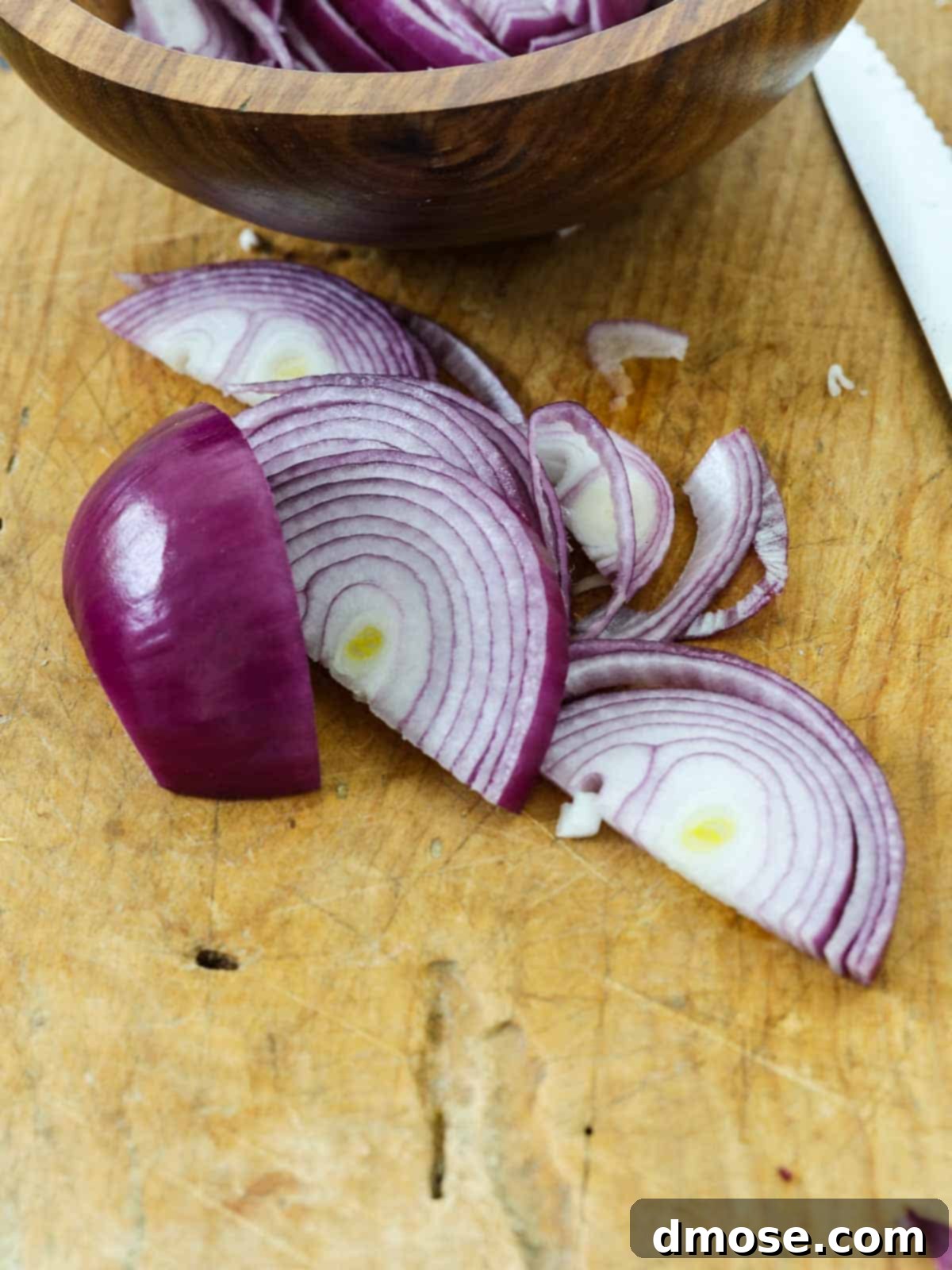 Slicing red onions for Mexican Pickled Red Onions.