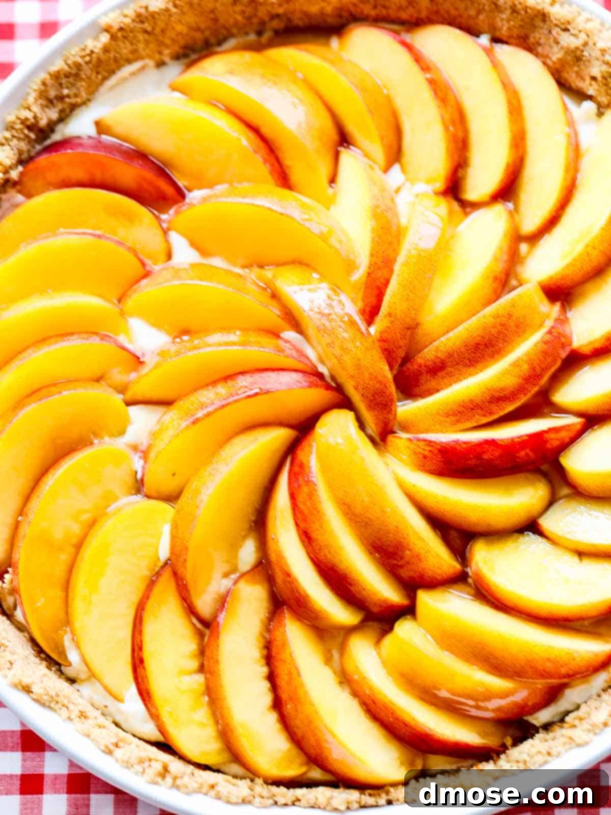 An inviting overhead shot of the complete no-bake peach cheesecake pie, ready to be sliced and served.