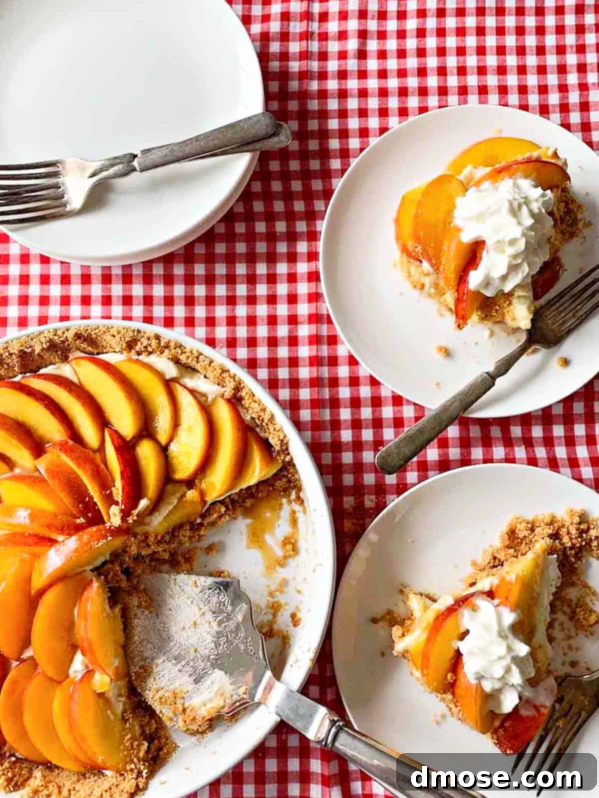 An overhead shot of a full no-bake peach cheesecake pie on a rustic wooden surface, ready for serving.