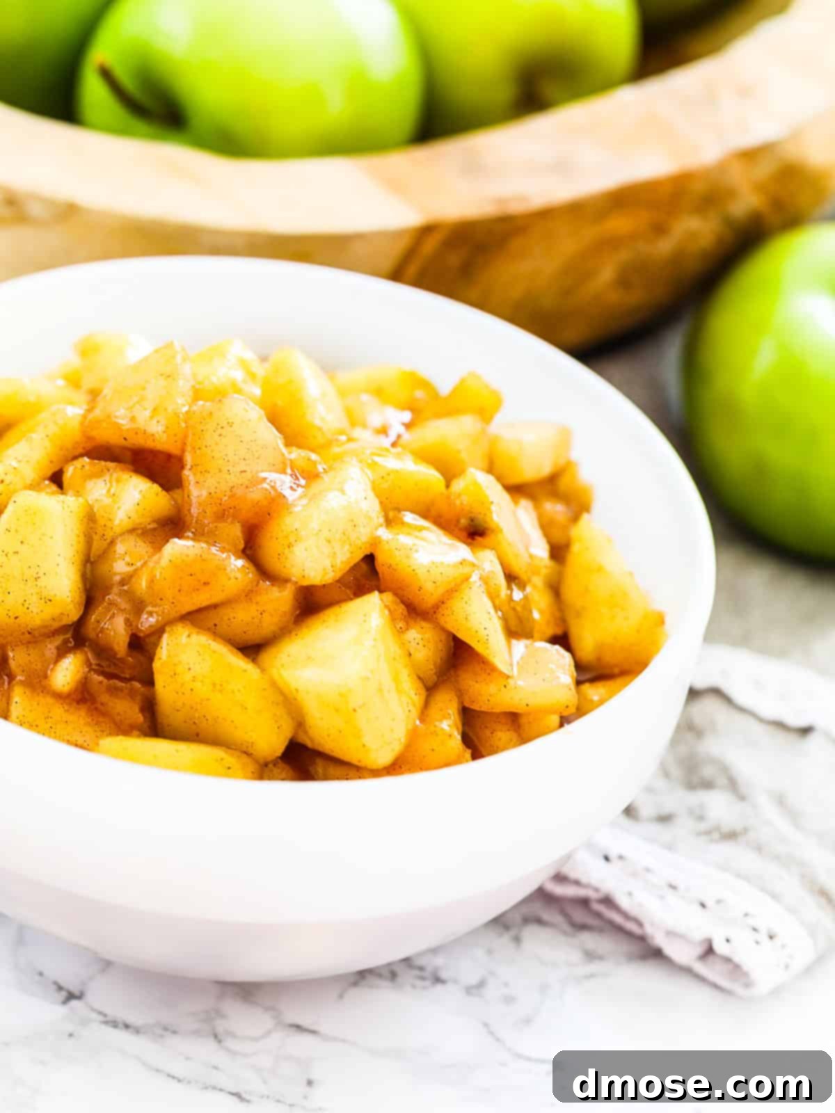 Cooked apple pie filling in a bowl ready to make pies.