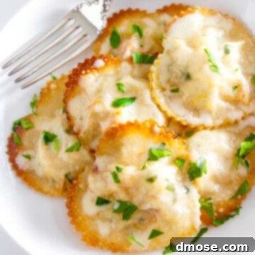 A white plate filled with beautifully arranged heart-shaped lobster ravioli, delicately garnished with fresh parsley, presenting a perfect dish for a romantic dinner.