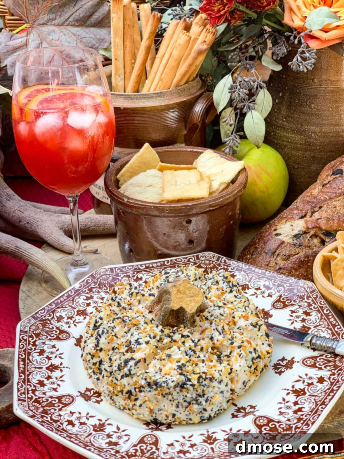 Harvest Everything Bagel Pumpkin Cheese Ball 8 Fall appetizers and drinks, featuring the Everything Bagel Cheese Ball, on a charming outdoor table.