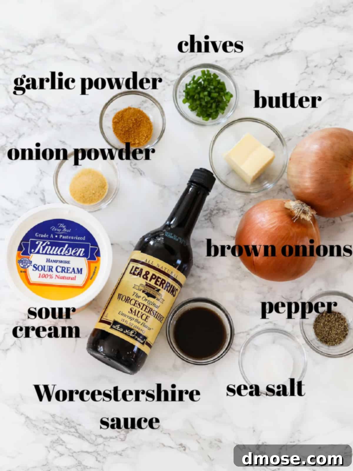 Fresh ingredients for French Onion Dip laid out, including onions, butter, sour cream, and spices.