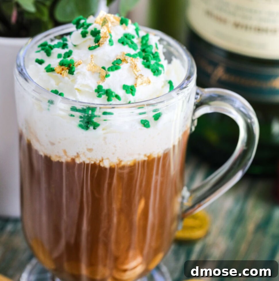 Irish Coffee Your Way: Baileys or Whiskey 7 A glass mug with Irish Coffee on a vintage green table topped with green sprinkles and edible gold.