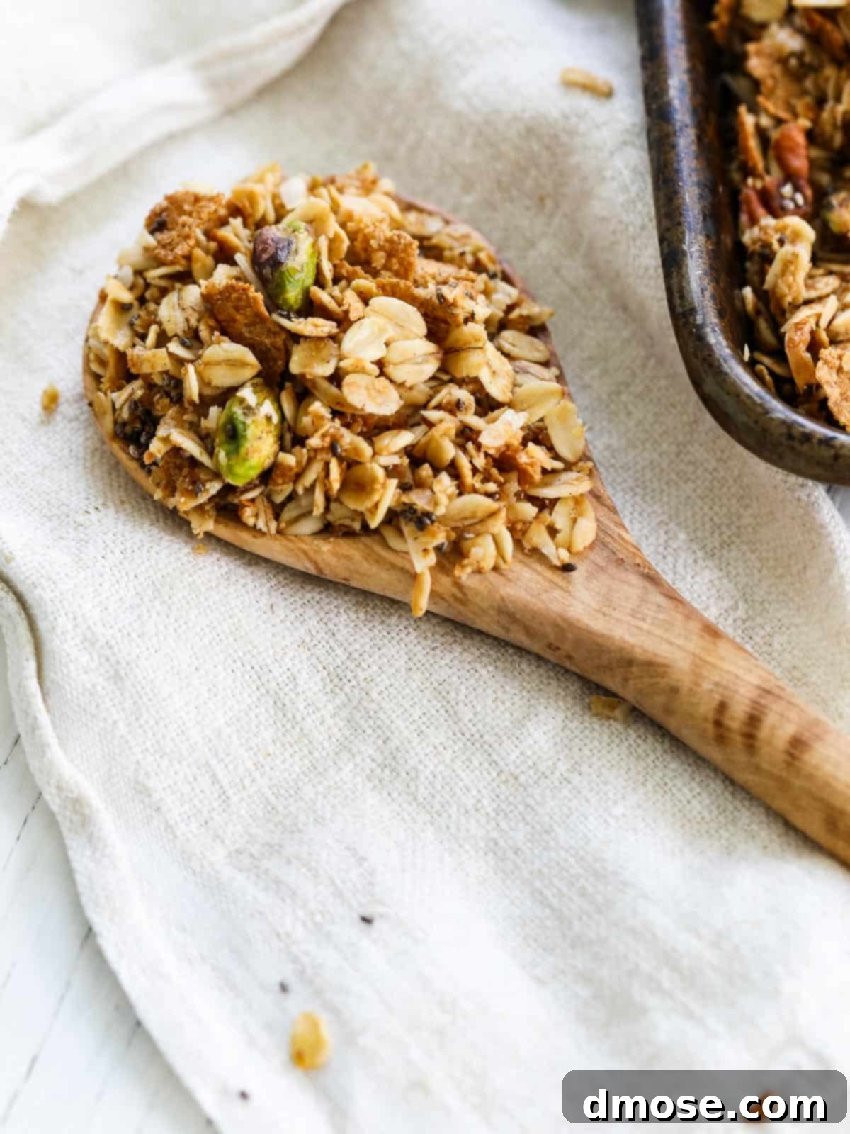 Wood spoon filled with granola