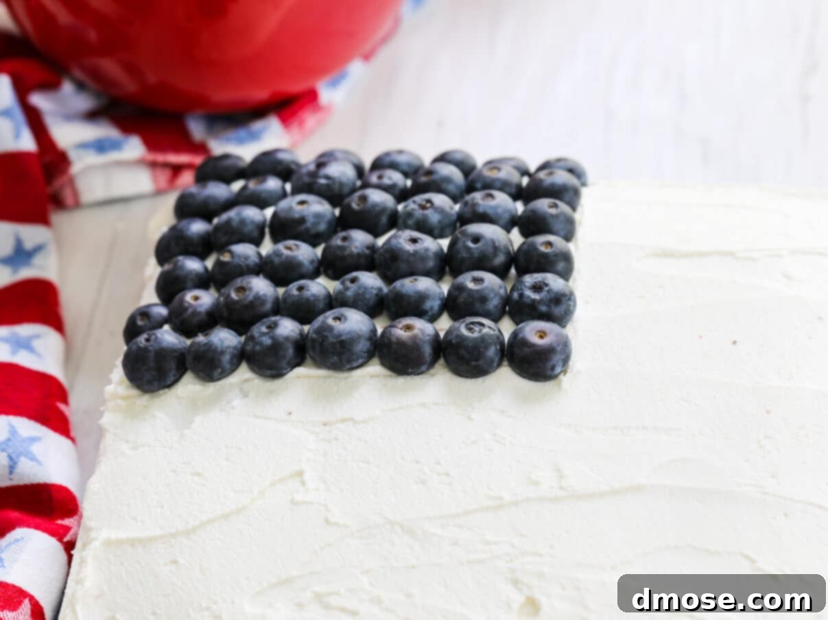 Blueberries placed on an American Flag July 4th cake, forming the blue field of the flag.