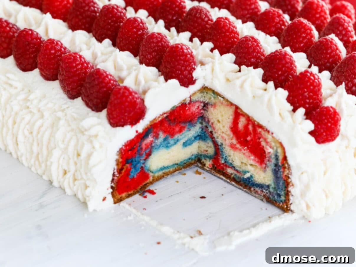 A July 4th American Flag Cake with a visible marbled interior, ready to be served.
