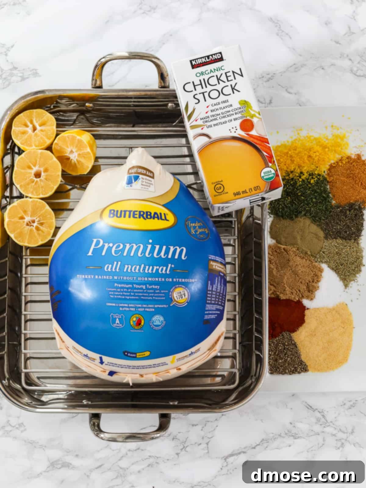 Various dry brine turkey roasting ingredients laid out on a wooden surface.