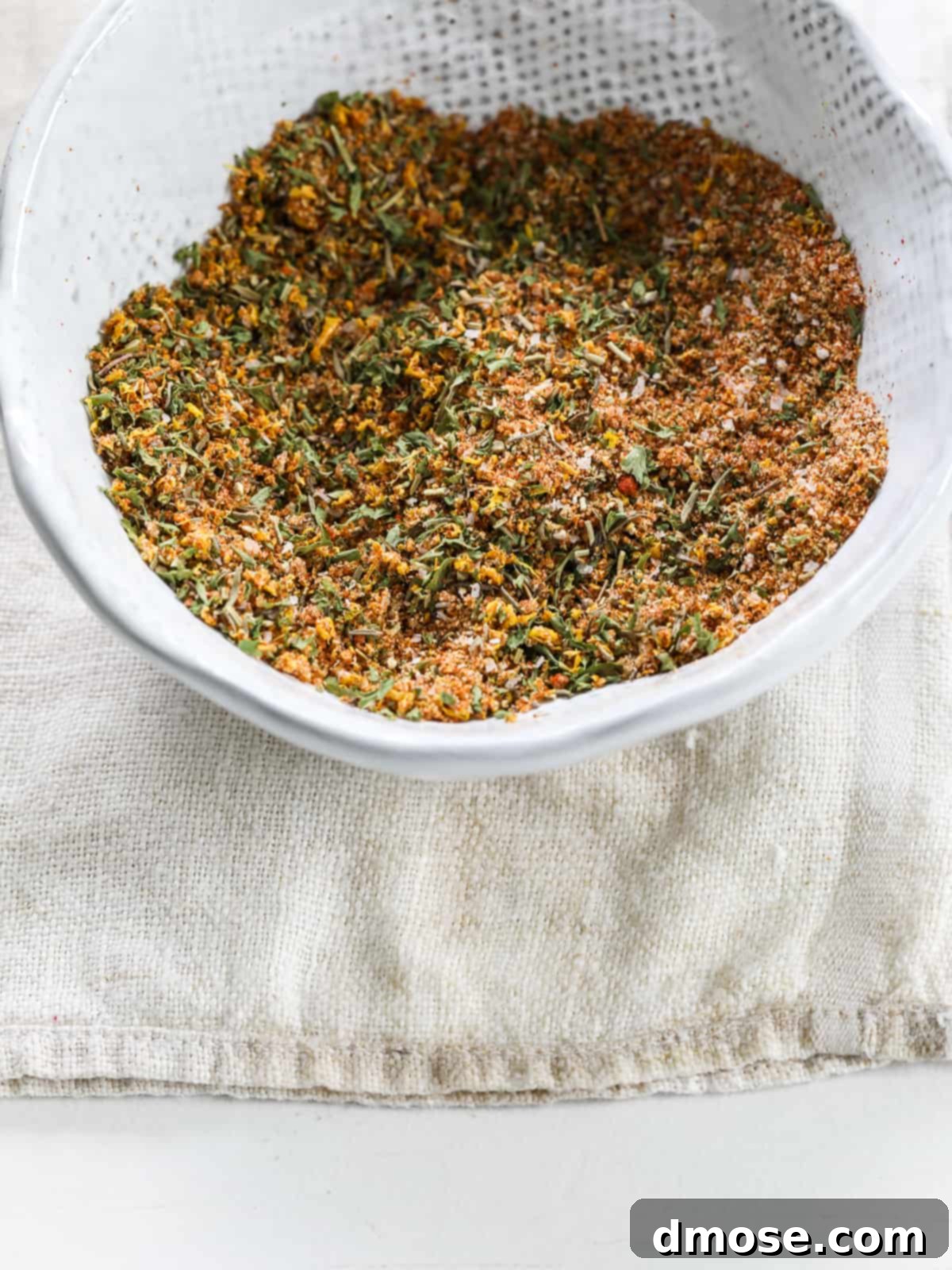 A bowl filled with Thanksgiving turkey rub, ready for application.