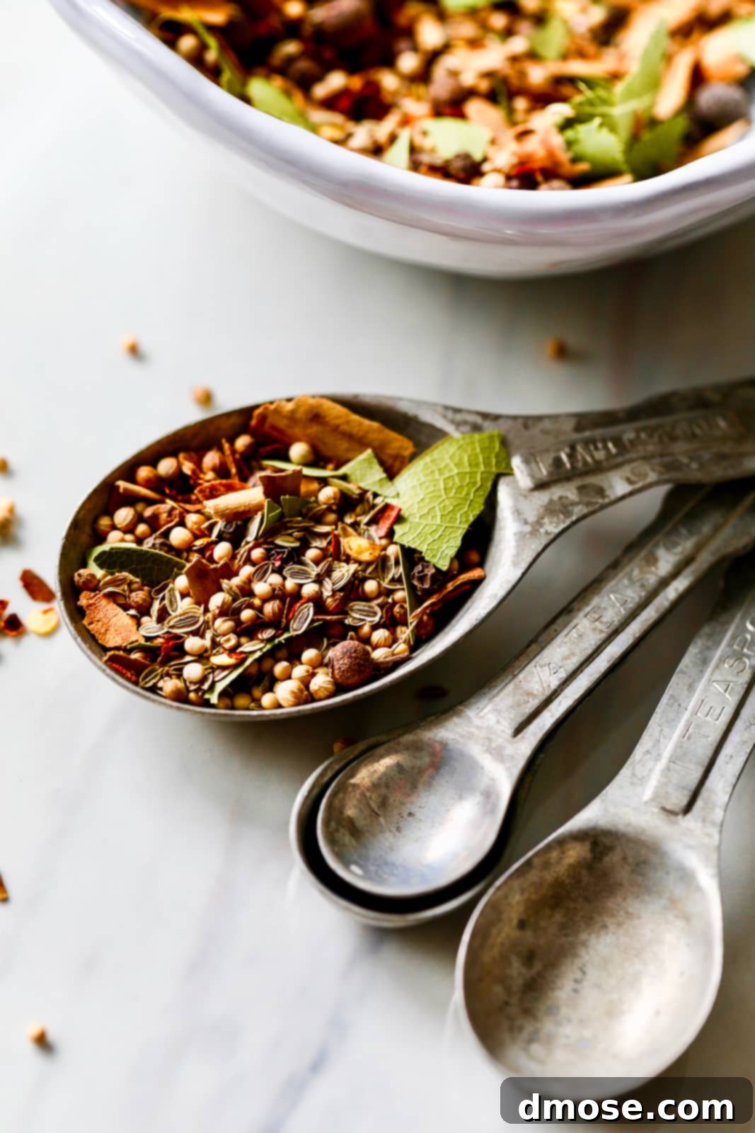 Slow-Cooked Corned Beef Perfection 15 Pickling spice inside the one tablespoon measure of a set of vintage aluminum measuring spoons.