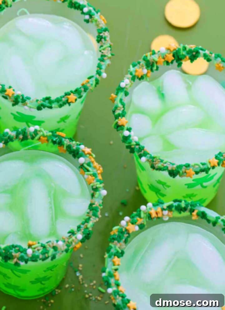 Slow-Cooked Corned Beef Perfection 23 Four glasses of green cocktails for St. Patrick's day on a green tray with gold coins.