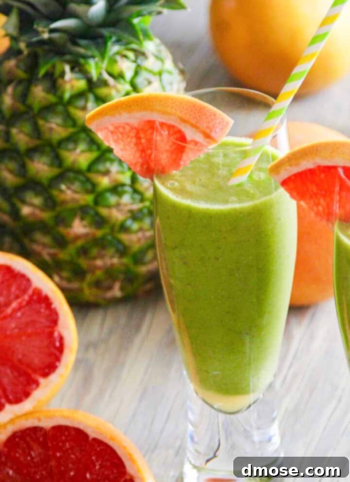 Slow-Cooked Corned Beef Perfection 25 Two glasses of a green smoothie recipe garnished with grapefruit slices and straws.