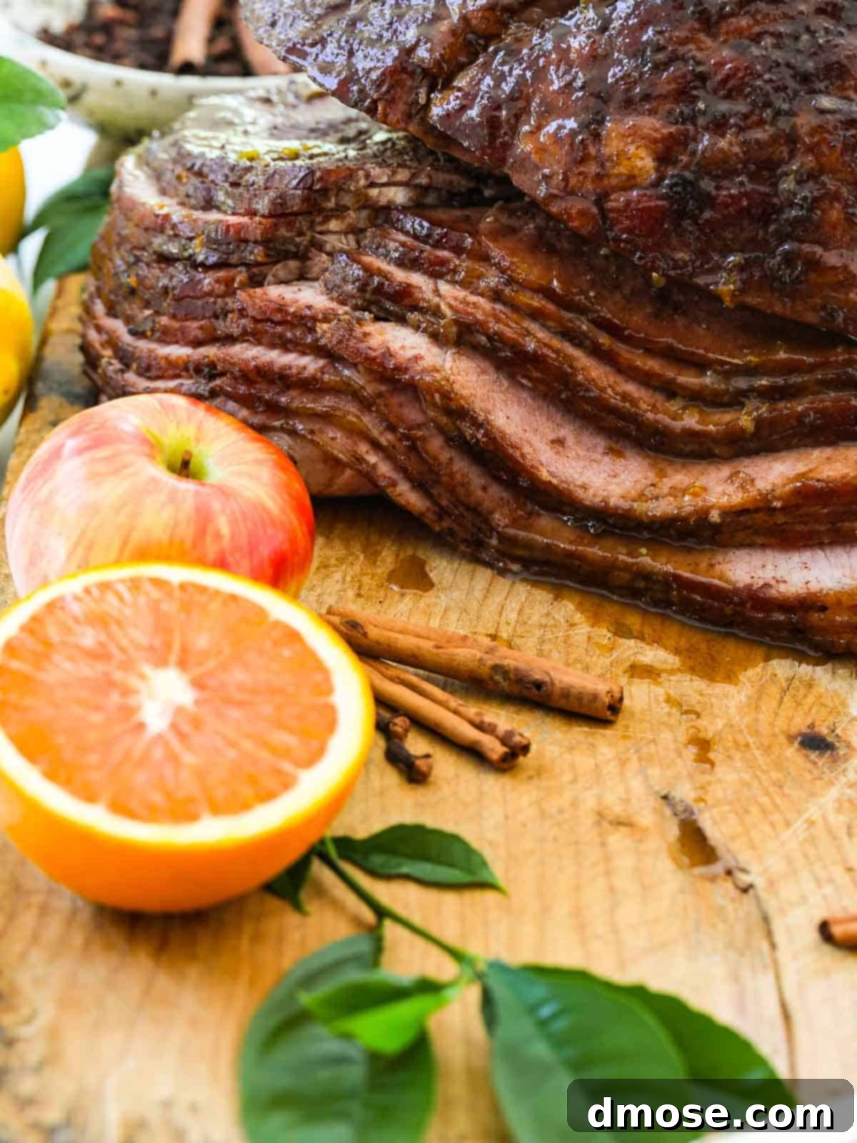 Rich Double Smoked Ham Zesty Orange Honey Glazed 17 A perfectly sliced spiral ham, beautifully glazed and arranged on a serving platter, ready for a holiday spread.