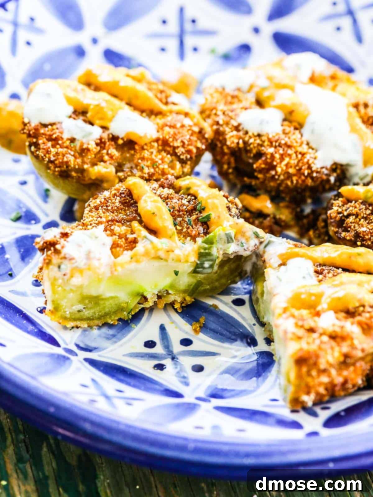 A plate of fried green tomatoes on a blue plate.