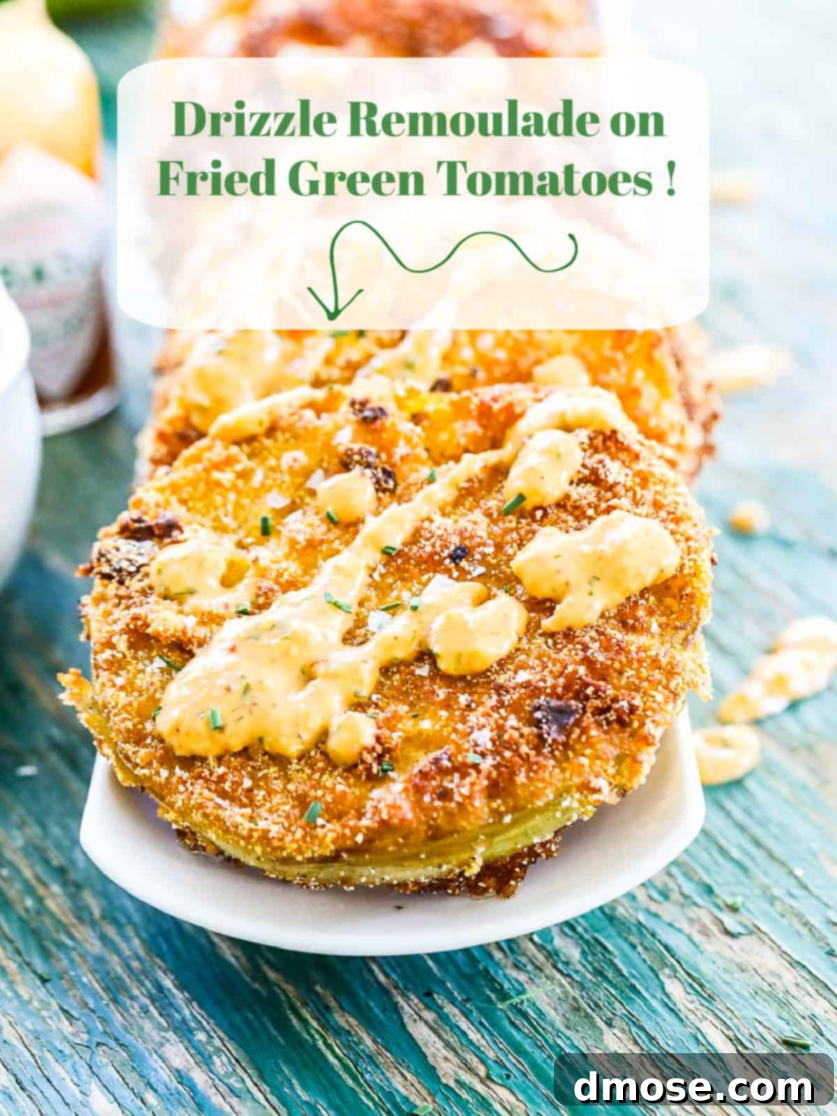 Remoulade sauce drizzled over fried green tomatoes.