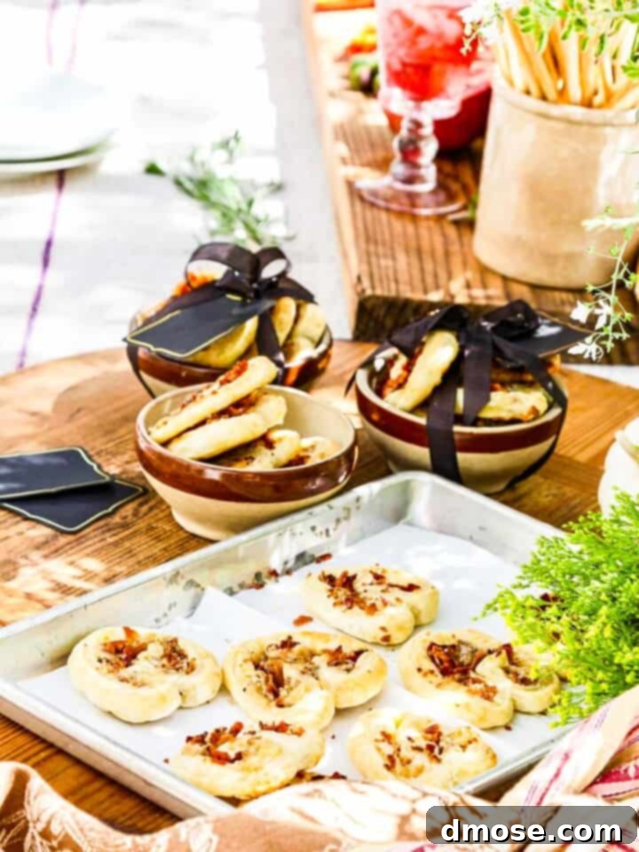 A sheet pan with freshly baked brie and bacon palmiers out of the oven, packaging them to give as gifts.