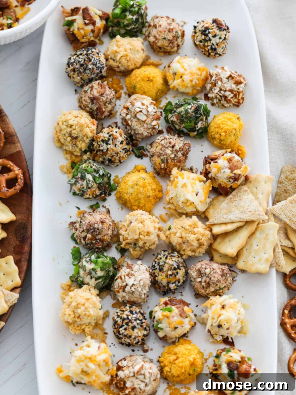 Gourmet Cheese Truffle Bites 5 A small plate showcasing several cheese truffles with different toppings, ready for an appetizer spread.