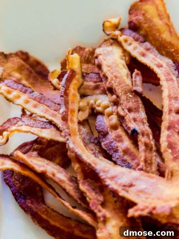 Gourmet Cheese Truffle Bites 6 A pile of strips of crisp bacon in a pile to use in a recipe.