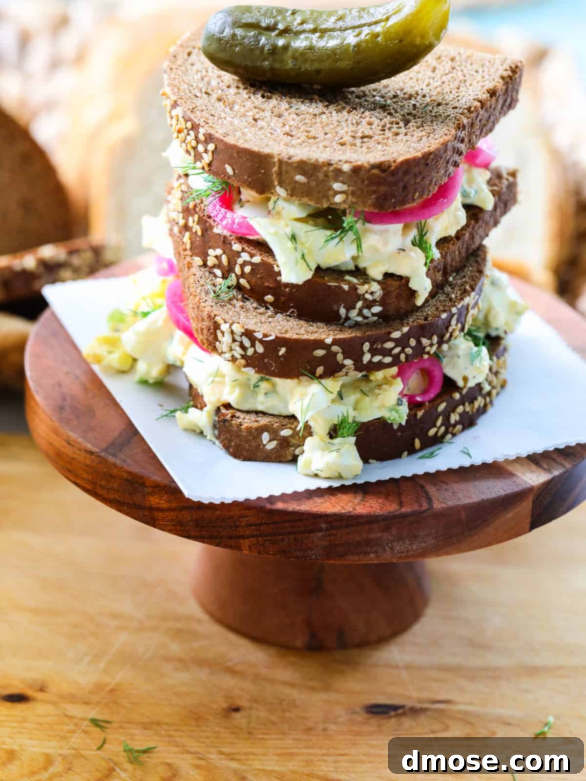 Savory Egg Salad Sensation 12 Egg salad served on pumpernickel bread, garnished and ready.