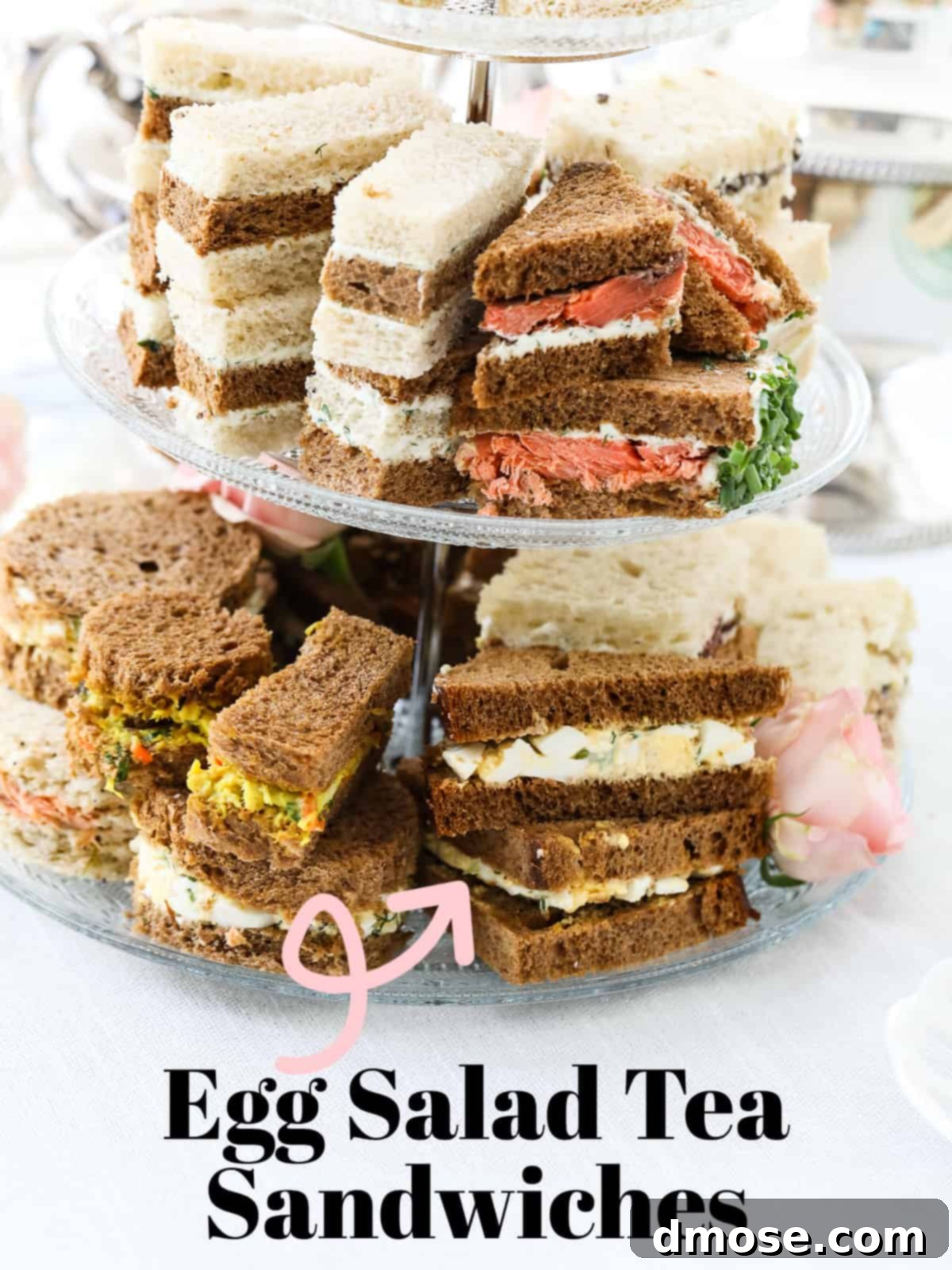 Savory Egg Salad Sensation 13 Dainty egg salad tea sandwiches arranged on a tiered serving tray.