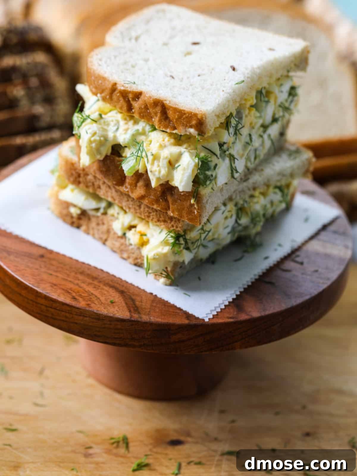Savory Egg Salad Sensation 14 An egg salad sandwich on white bread, ready to eat.