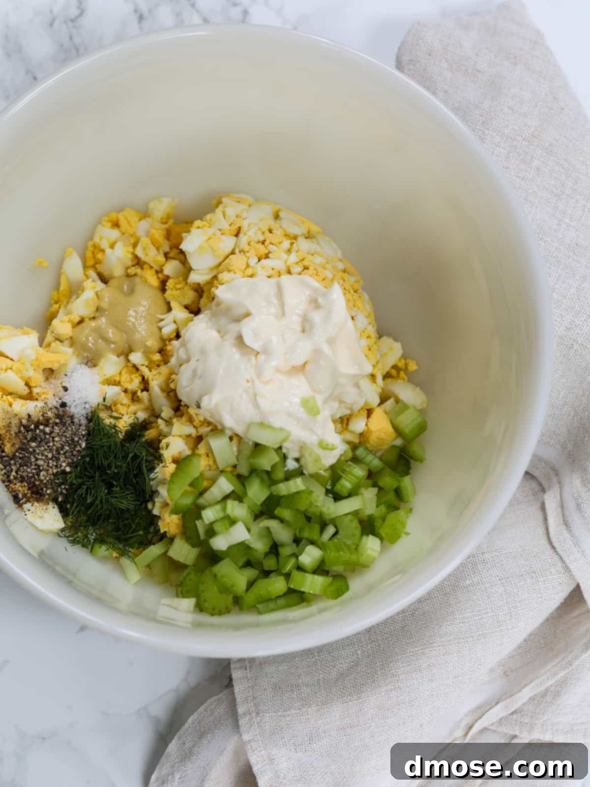 Savory Egg Salad Sensation 7 All the egg salad ingredients mixed in a bowl.