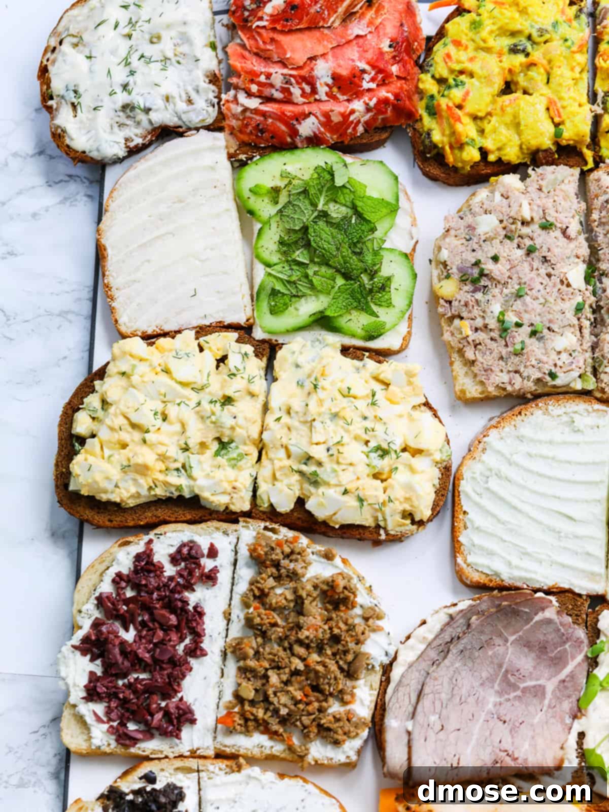 Savory Egg Salad Sensation 9 Making sandwiches, including an egg salad sandwich, on a wooden board.