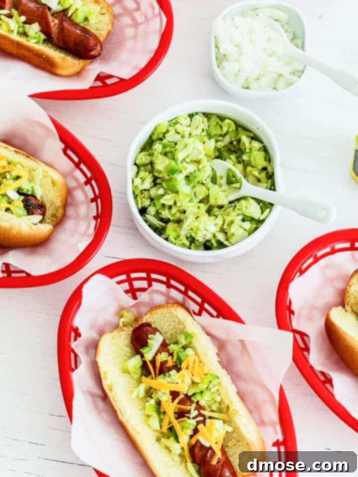 Graduation Party Food Inspiration for 2024 12 Red food baskets filled with hot dogs and toppings at a cookout party.