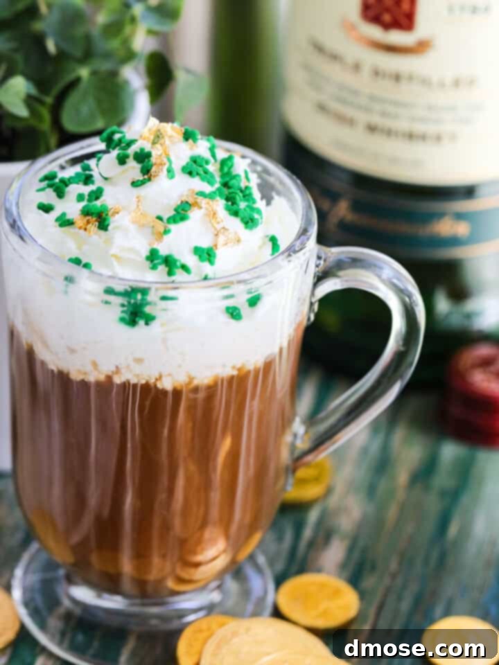 Graduation Party Food Inspiration for 2024 18 A glass mug with Irish Coffee on a vintage green table topped with green sprinkles and edible gold.