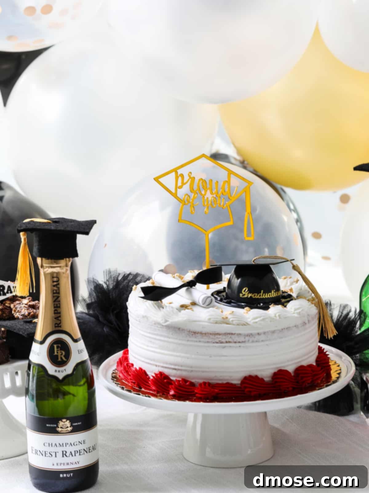 Graduation Party Food Inspiration for 2024 3 A beautifully decorated graduation cake with champagne flutes, ready for a toast.