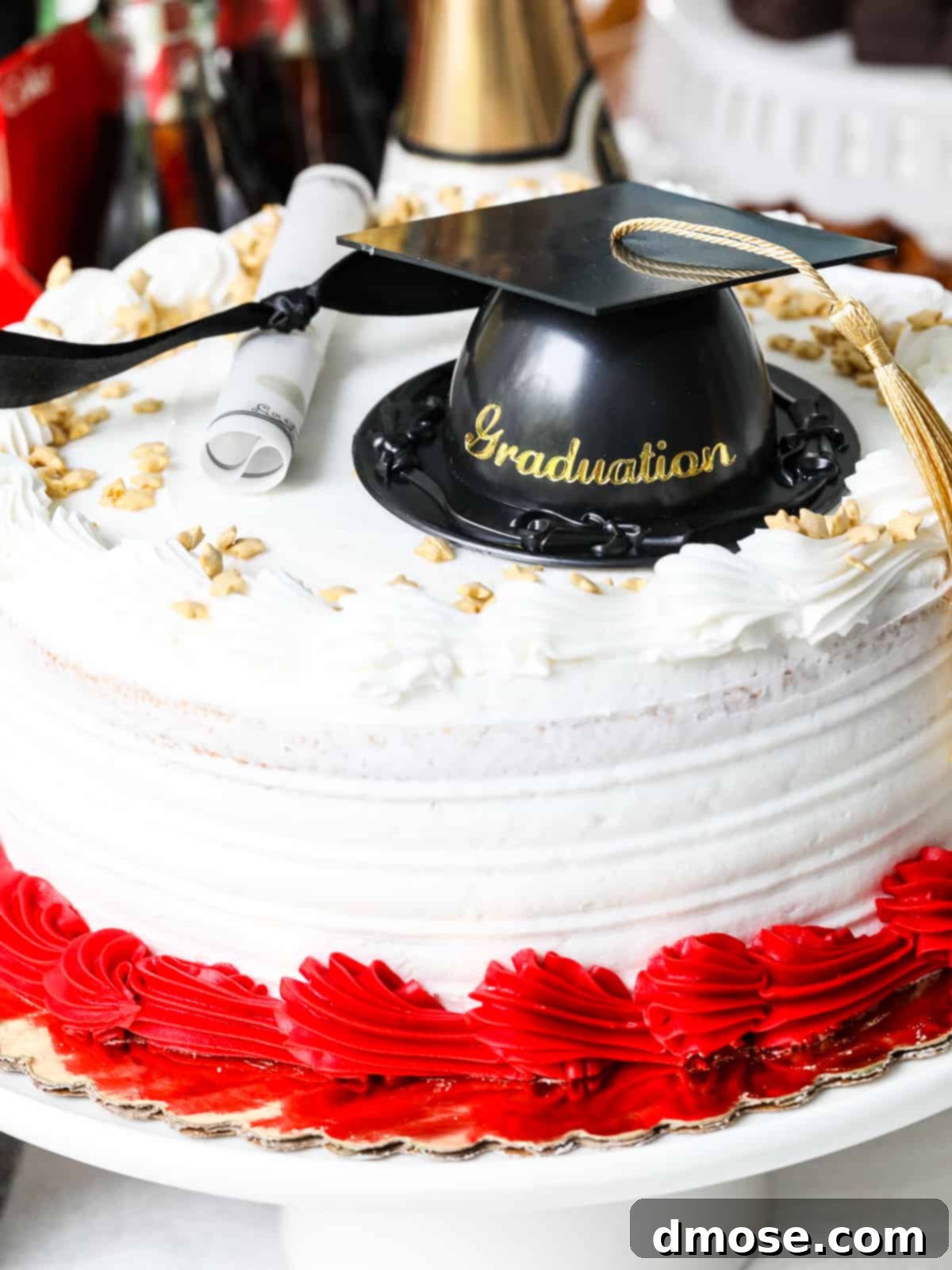 Graduation Party Food Inspiration for 2024 20 A beautiful graduation cake with a cap and diploma decoration, captured up close.
