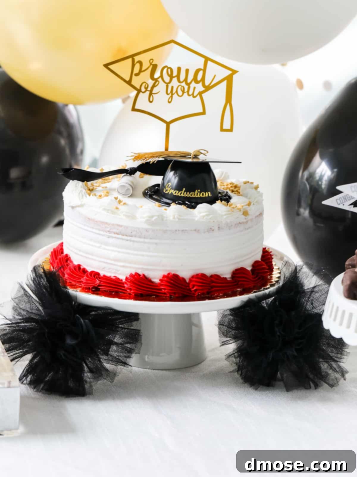 Graduation Party Food Inspiration for 2024 9 A festive graduation cake on a decorative stand.