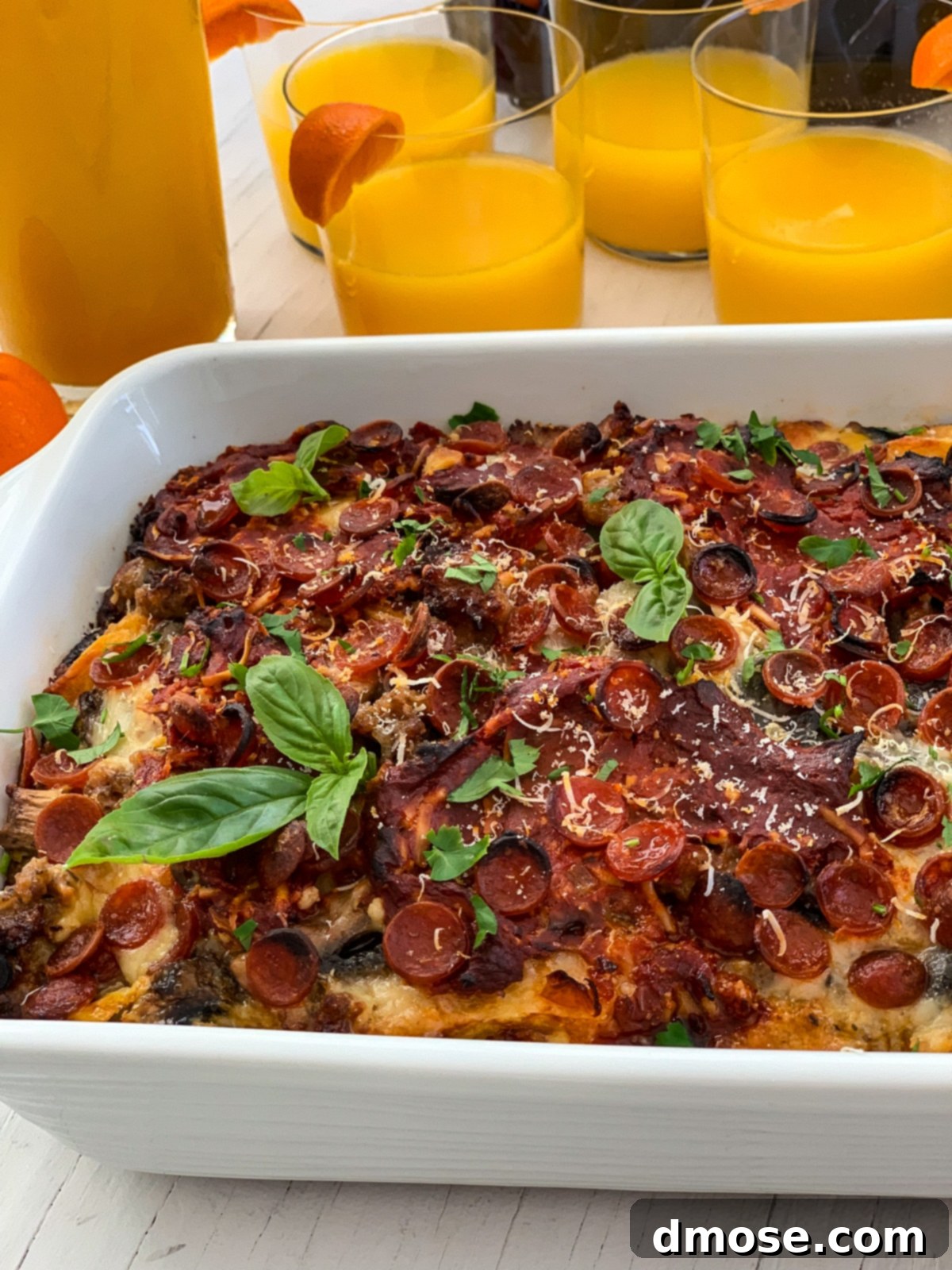 Cheesy Pizza Breakfast Bake 15 A baked pizza breakfast casserole, still in the white baking dish, fresh from the oven.