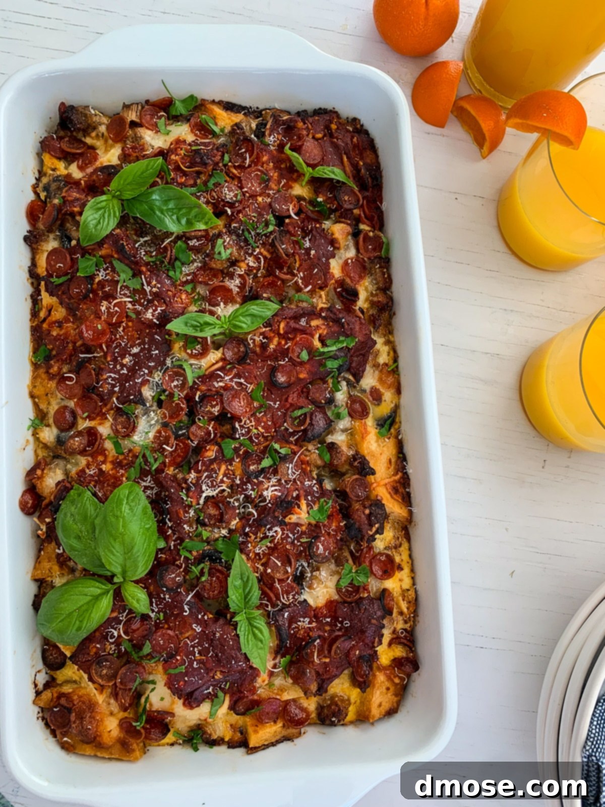 Cheesy Pizza Breakfast Bake 3 Overhead view of a freshly baked breakfast casserole with melted cheese and pepperoni, ready to be served.