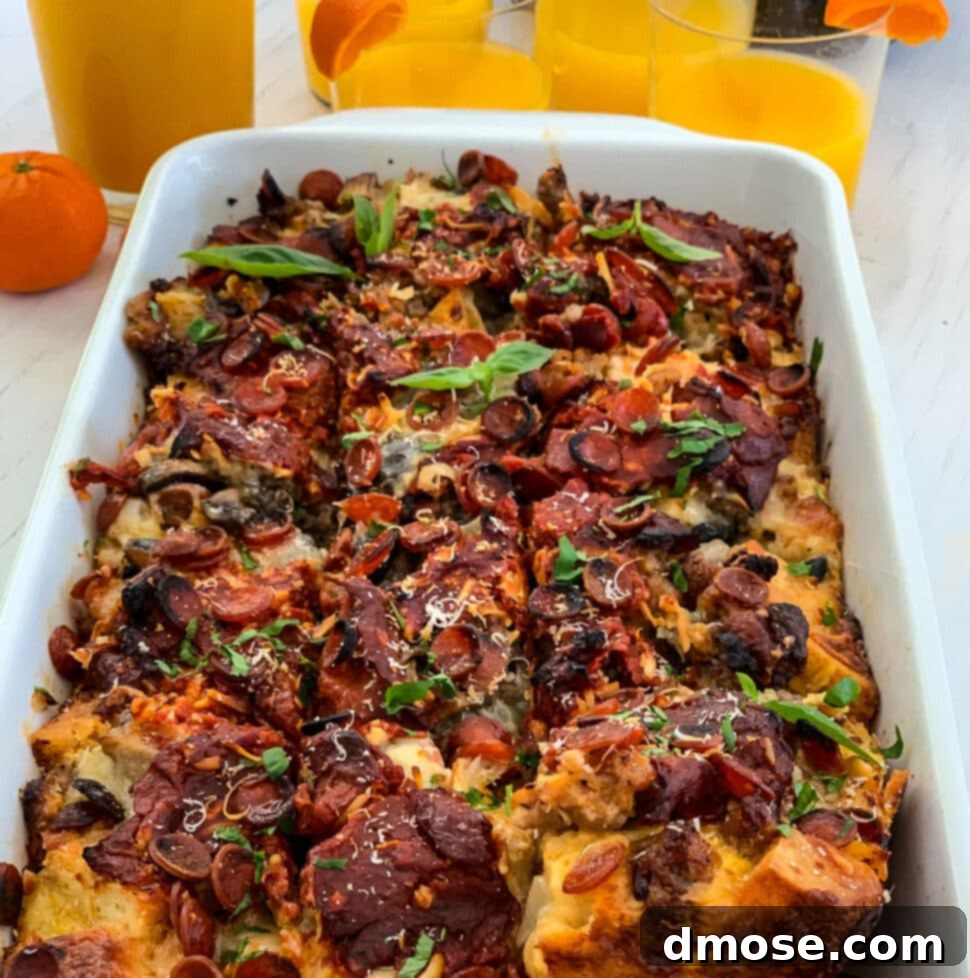 Cheesy Pizza Breakfast Bake 19 Lifting out a piece of breakfast casserole from a white baking dish with a serving utensil from the strata.