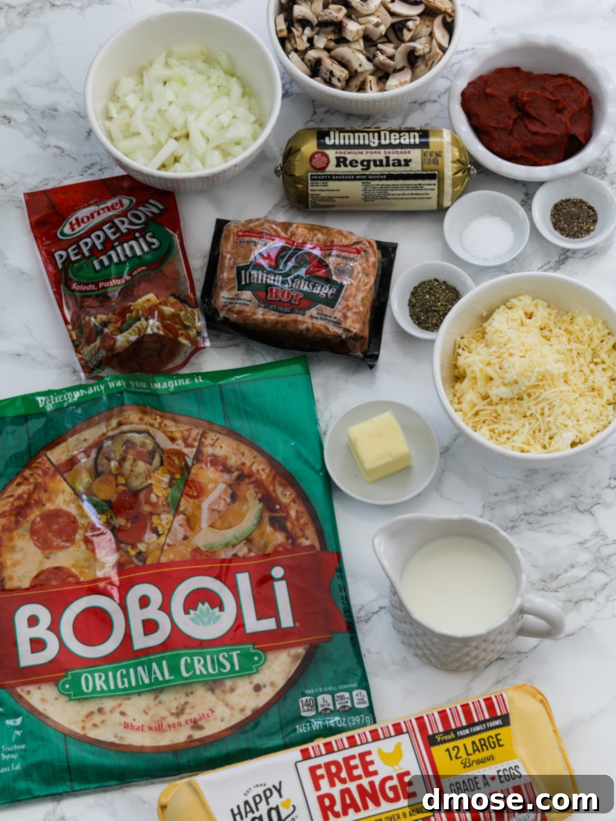 Cheesy Pizza Breakfast Bake 5 All the fresh ingredients for the pizza breakfast casserole laid out on a kitchen counter.
